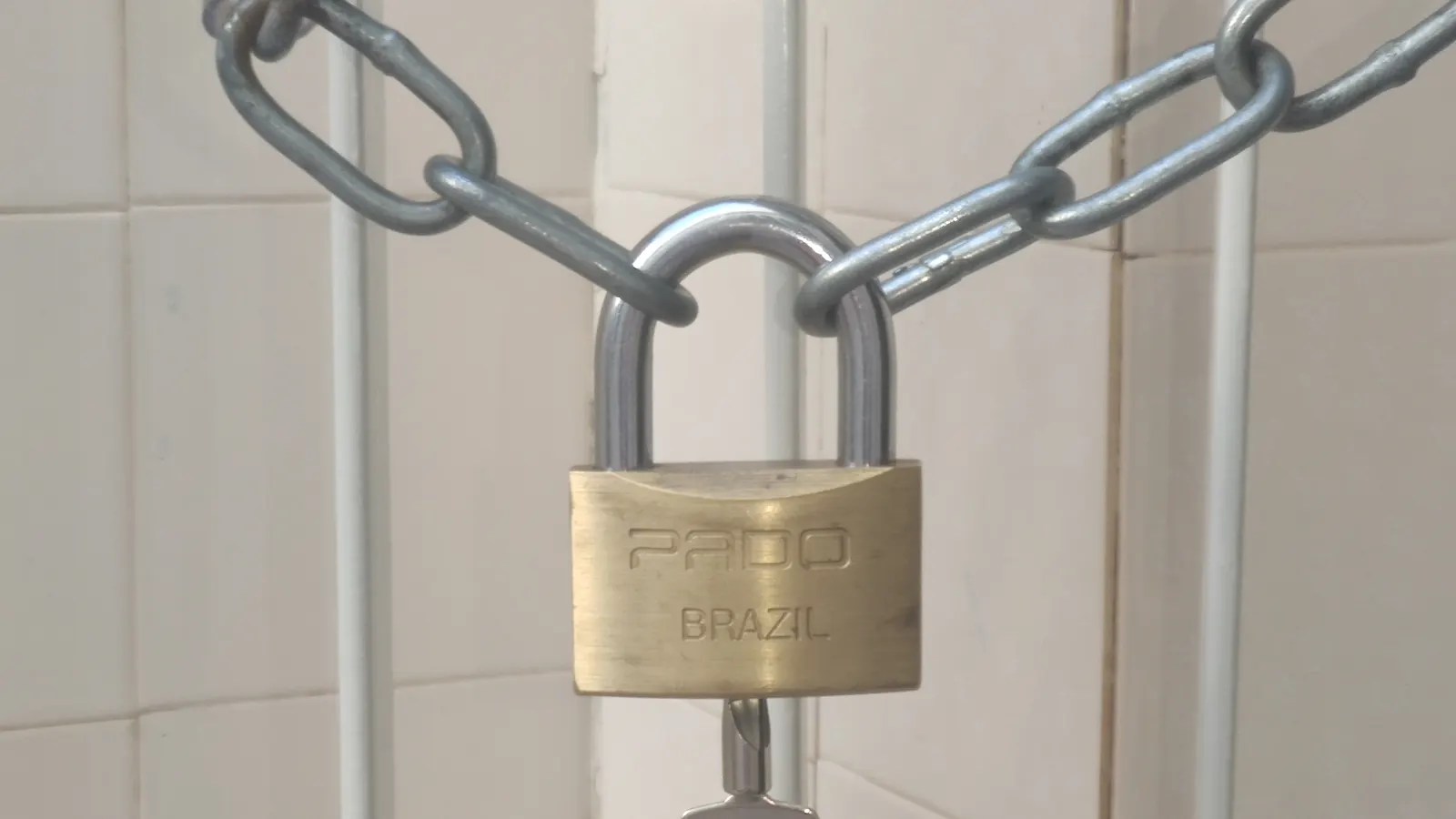 Padlock and chain on a door, a reminder to buy Minecraft alts safely from sellers you can verify
